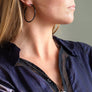 Xtinctio Necklace Amulet individually hand forged in Italy from White Bronze and green Etruscan Enamel in honor of the Rainforest.  Eco friendly cotton linen blend waxed cord sourced in Italy.