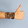 xtinctio - cord bracelet Individually hand forged in Italy from White Bronze and yellow Etruscan Enamel in honor of the critically endangered Tiger.  Eco friendly cotton linen blend waxed cord sourced in Italy.