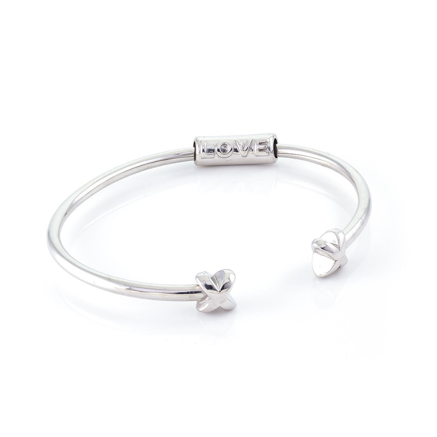 Xtinctio Bracelet Made in Italy Recycled Sterling silver Love XX bracelet eco conscious, chic and comfortable representing your commitment to protecting these critically endangered species and their habitats   An  X  at each end of the bangle and bead with the  word Love debossed  on it.
