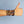 Xtinctio Bracelet - Individually hand forged in Italy from White Bronze and orange Etruscan Enamel in honor of the critically endangered Orangutan Eco friendly cotton linen blend waxed cord sourced in Italy.